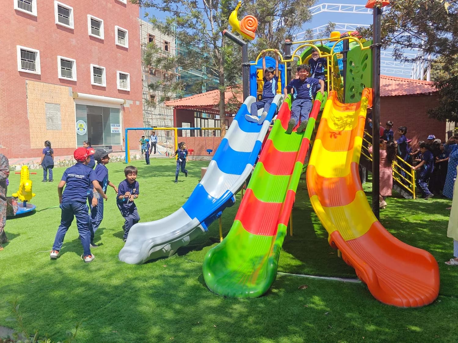 Kids playing on slides in the school playground